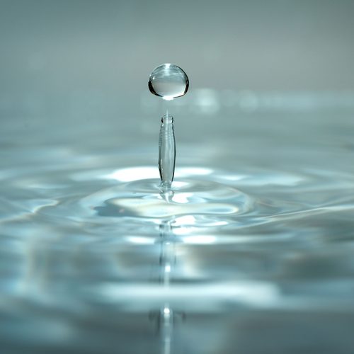 Droplet rising from water